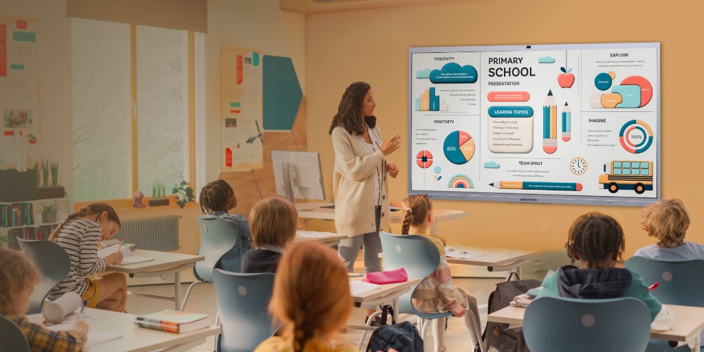 Interactive flat panel display being used as a smart whiteboard in a primary school classroom